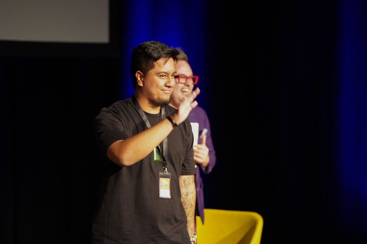 Joshua on stage at the summit