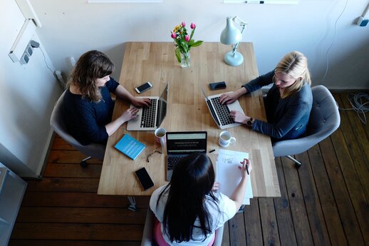 Three women working on laptops