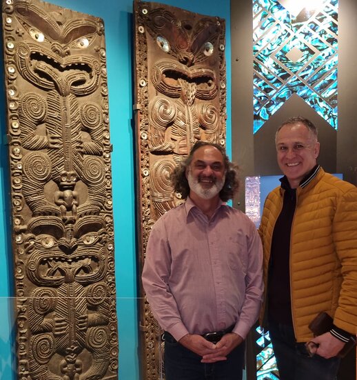 Te Hira Henderson and Dr Moana Nepia, Senior Research Fellow Media Design School in front of two of the carved wooden pou at Heretaunga III.