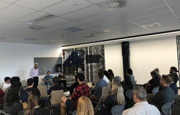 Dr Haare Williams speaks to the room